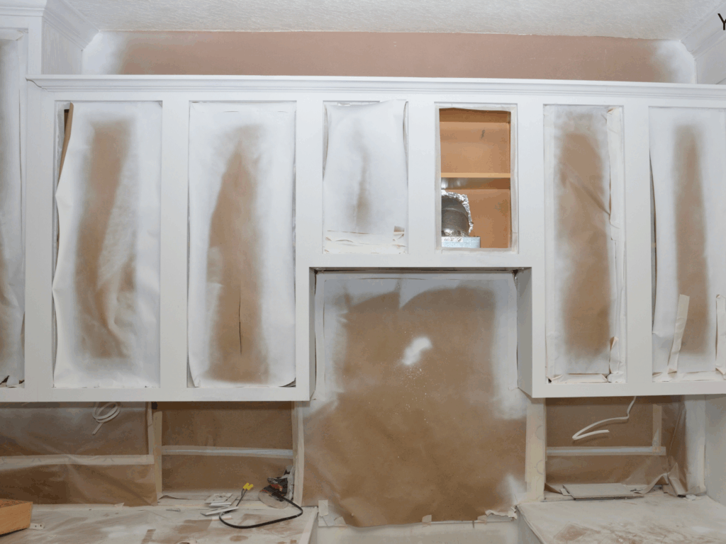 Cabinet refinishing in progress with doors removed – Precision Painters