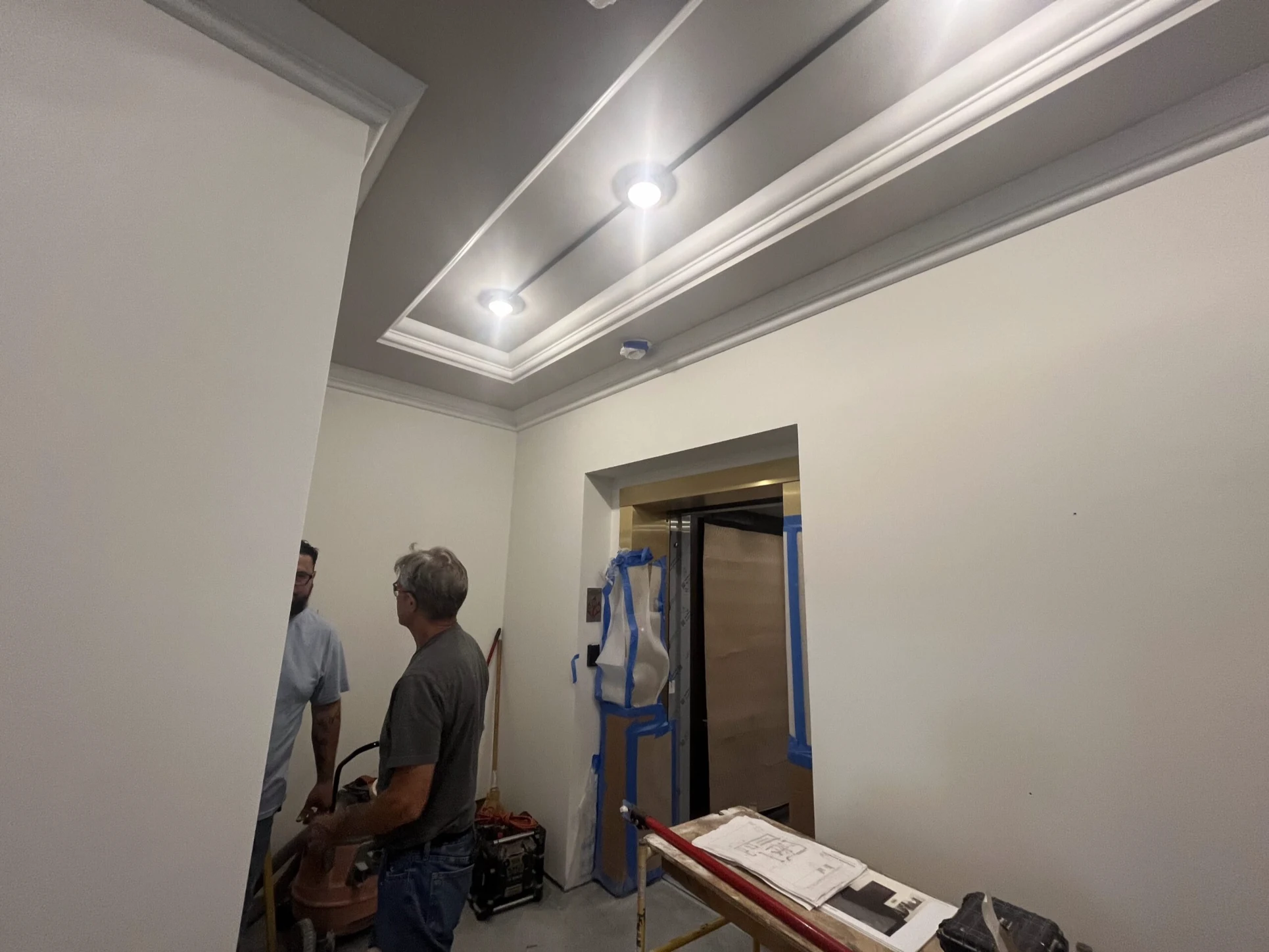 Interior painting professionals from Precision Painters working inside a Tampa home