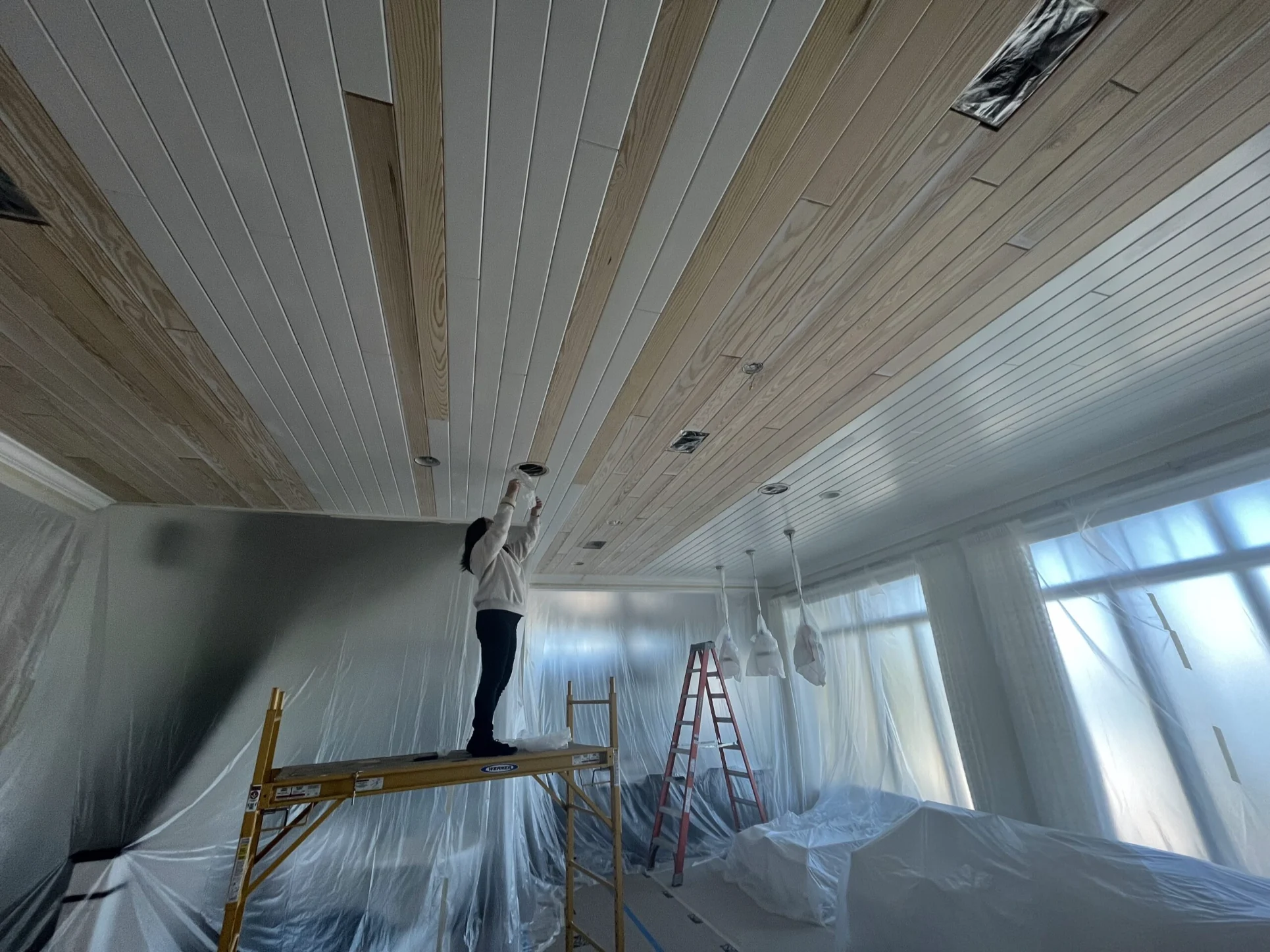 Precision Painters completing ceiling preparation for a residential interior painting project